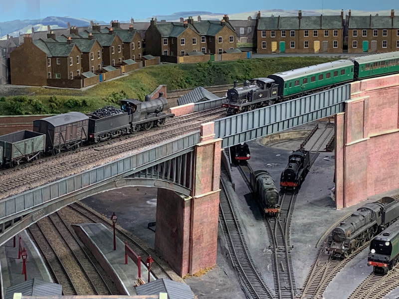 Steam trains crossing bridge